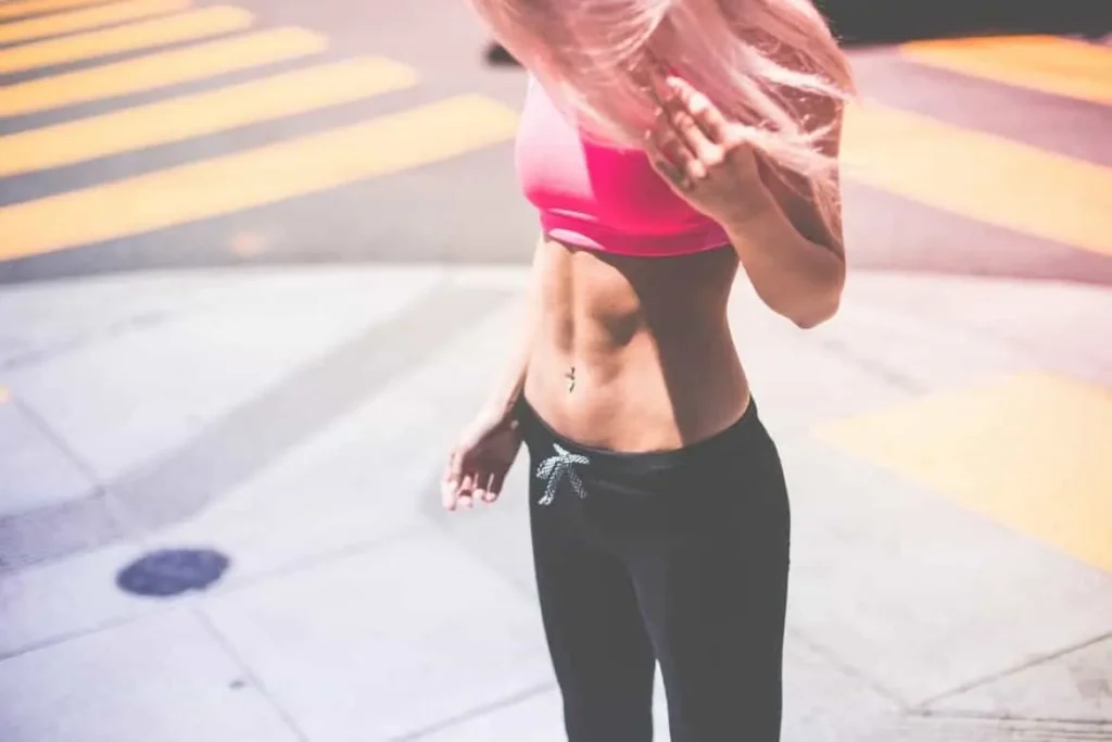 Woman with toned stomach after LA-EMS Body Sculpting Treatment Hyde Park Corner